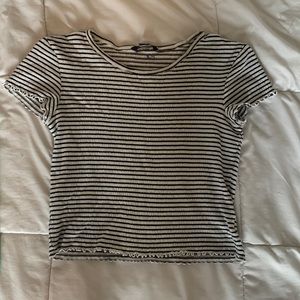 White and black American Eagle shirt.